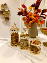 Load image into Gallery viewer, Glass and Gold Canister With Leaf Design
