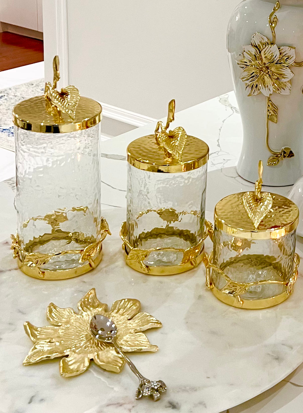 Glass and Gold Canister With Leaf Design