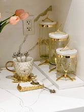 Load image into Gallery viewer, Glass Canister On Gold Twig Base with White Marble Cover
