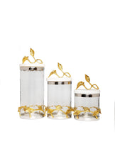 Load image into Gallery viewer, Gold and Glass Canister With Leaf Design And Marble Lid
